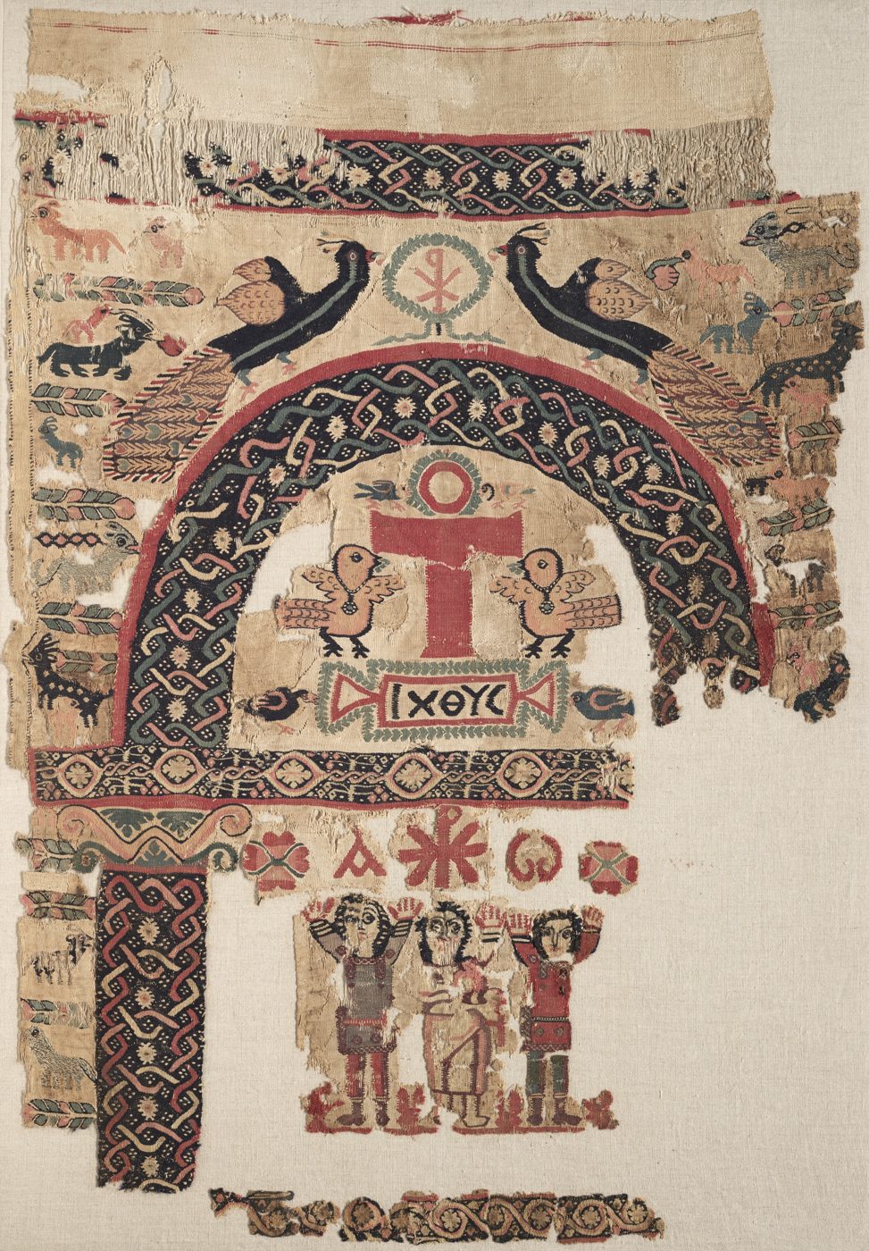 Woven hanging with an arch, a cross and birds